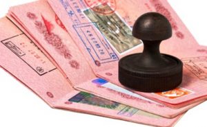stack of passports and stamp