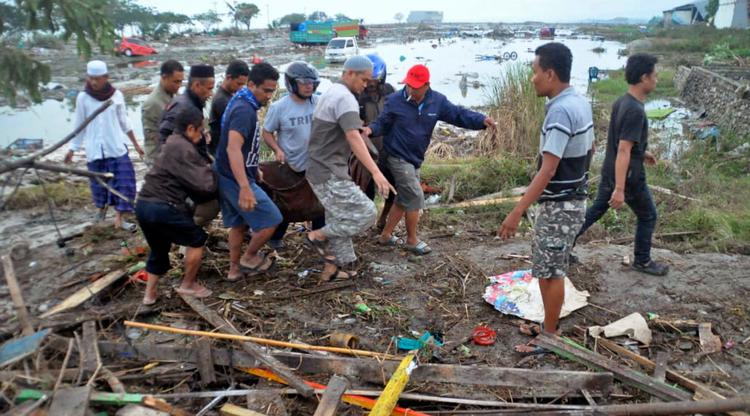 075998100_1538190383-20180929-Setelah-Gempa-dan-Tsunami-Melanda-Palu-AFP-9.jpg